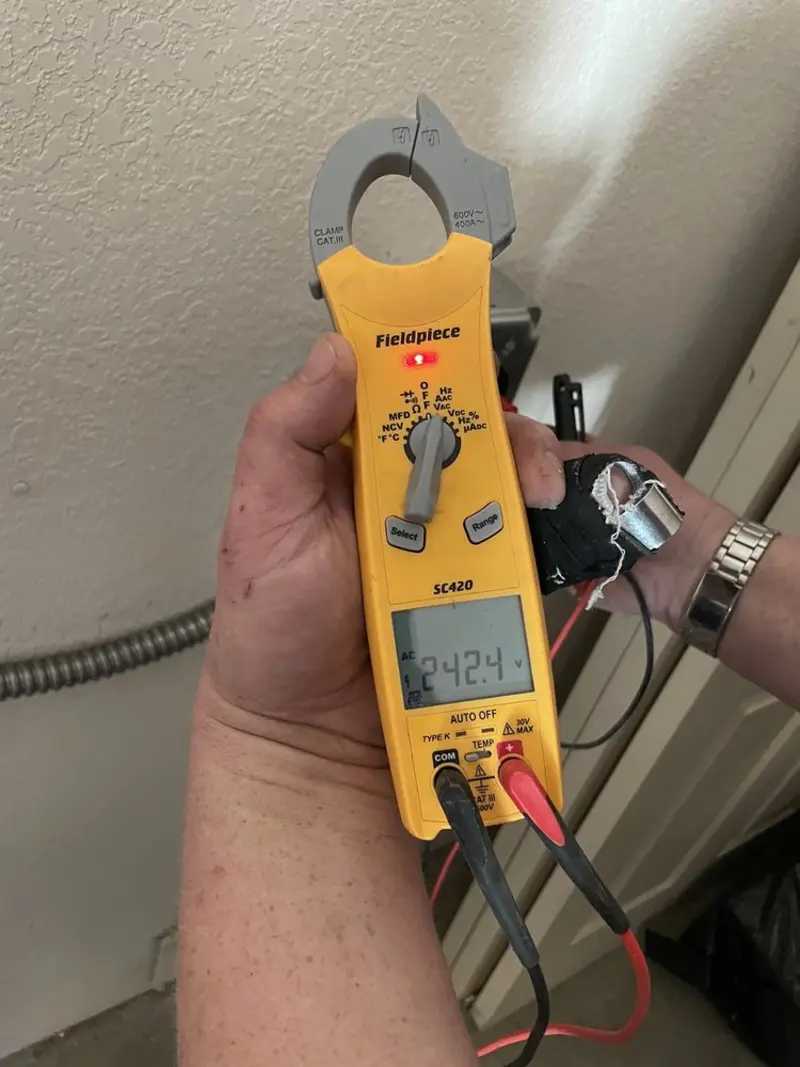 Voltage testing with clamp meter during Aluminum Wiring Replacement in Lake Wildwood